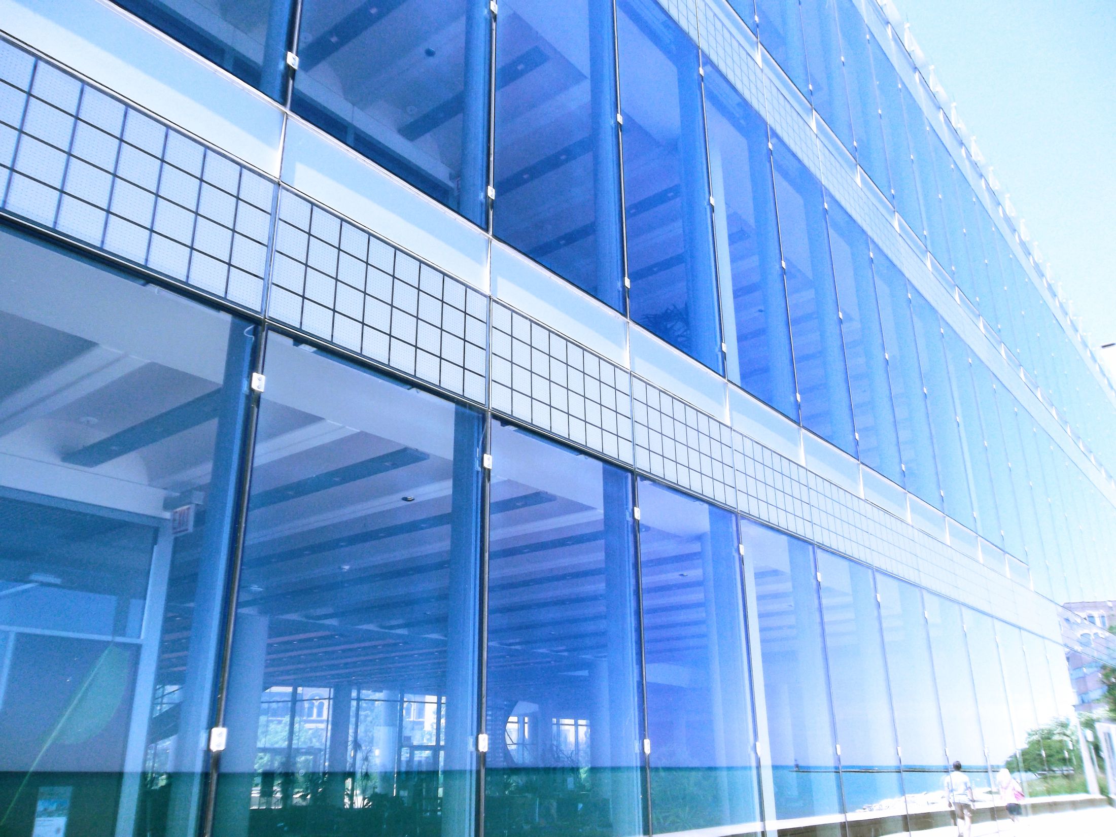 Glass facade with intersecting architectural lines