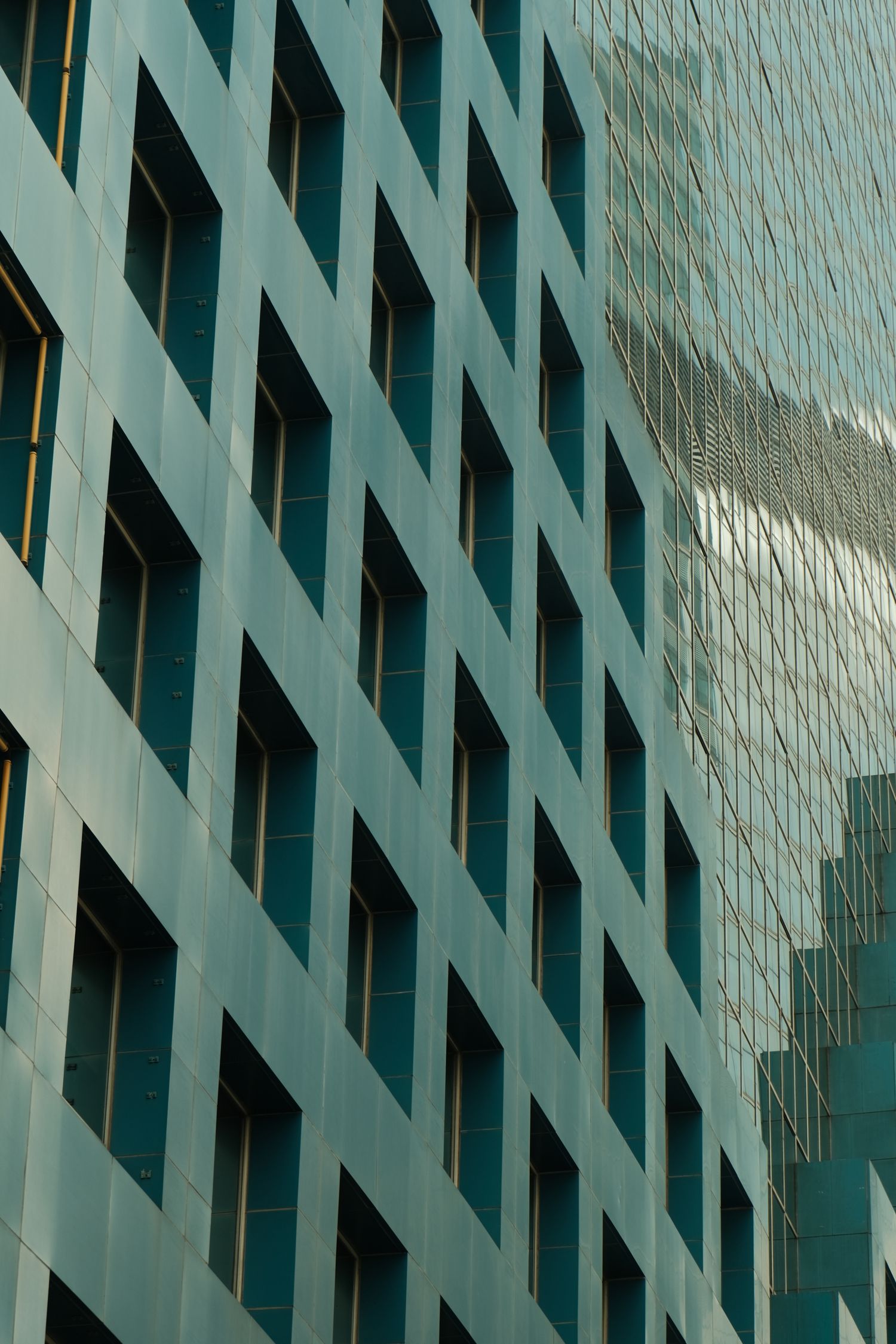 Reflective geometric windows on a glass building